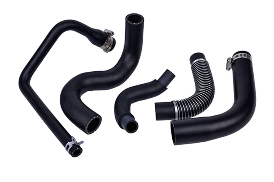 Fuel resistant rubber hose formed bypass tube