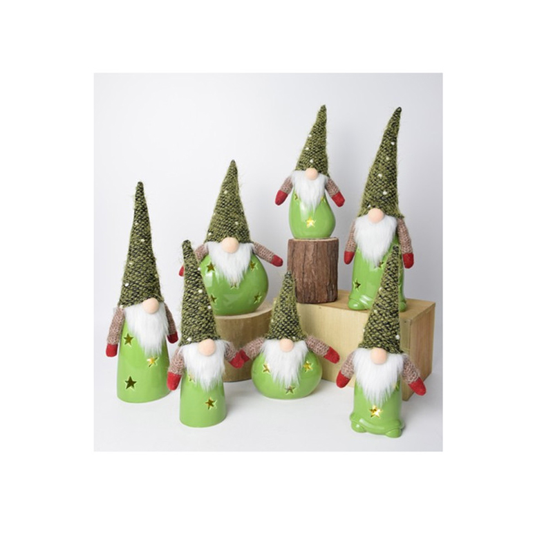 A group of 5 or 7 Ceramic Gnomes with plush hats