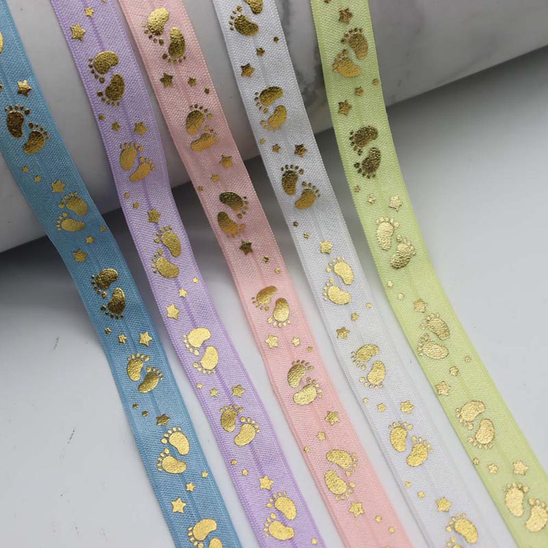 5/8 inches gold foil baby footprints printed fold over elastic ribbon for hair ties